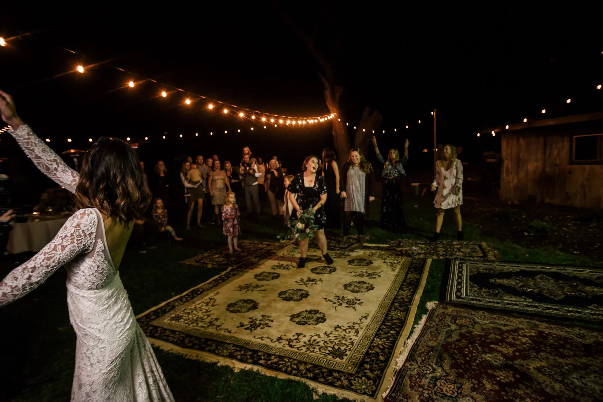 guest catches bouquet at rustic pymm ranch wedding venue in winchester california