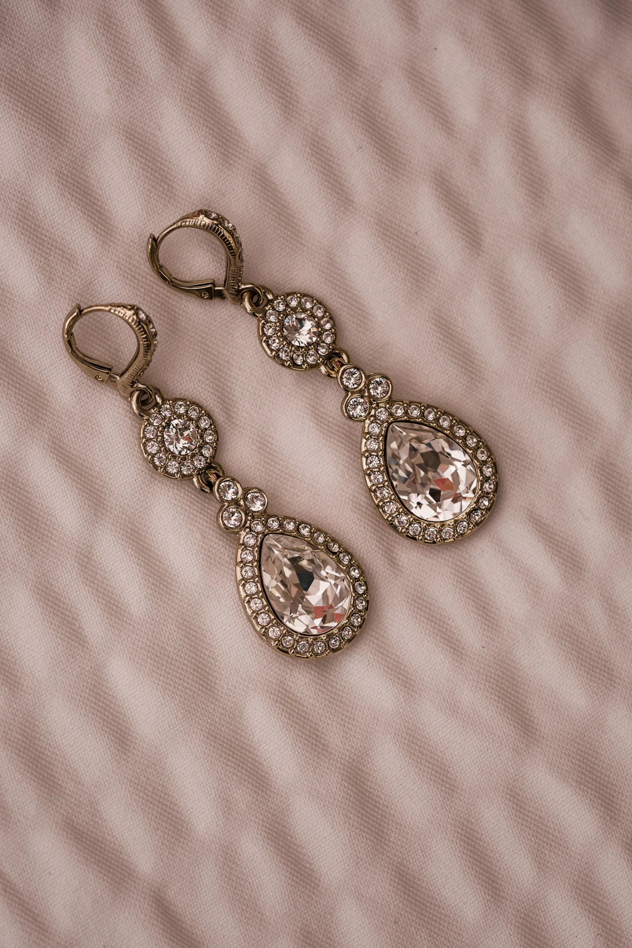beautiful brides set of earings on a white background at the Twin Oaks Golf course in san marcos, San diegos premier wedding venue