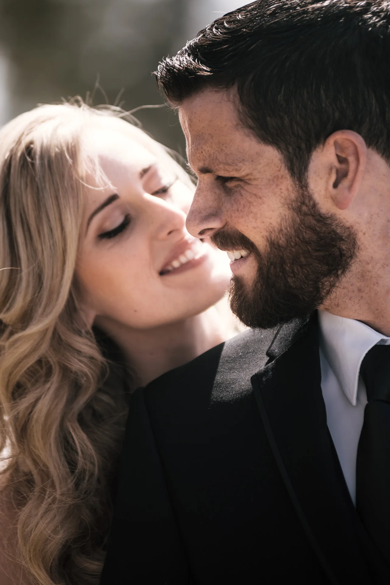 bride is all smiles while she looks at her groom at the Twin Oaks Golf Course in San Marcos, San Diegos premier wedding venue