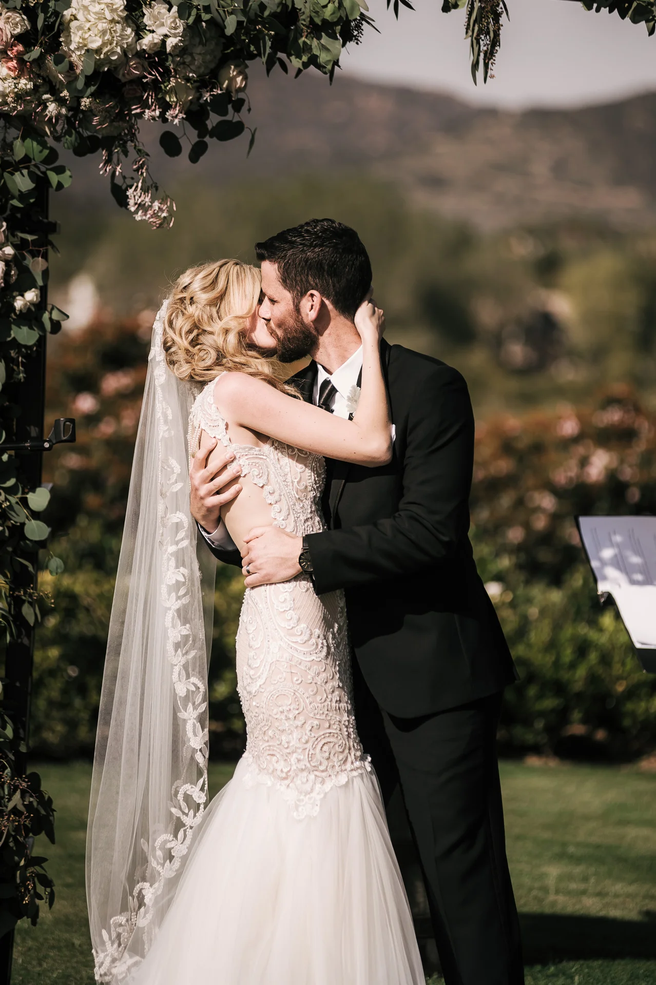 first kiss at the Twin Oaks Golf Course in San Marcos, San Diegos premier wedding venue