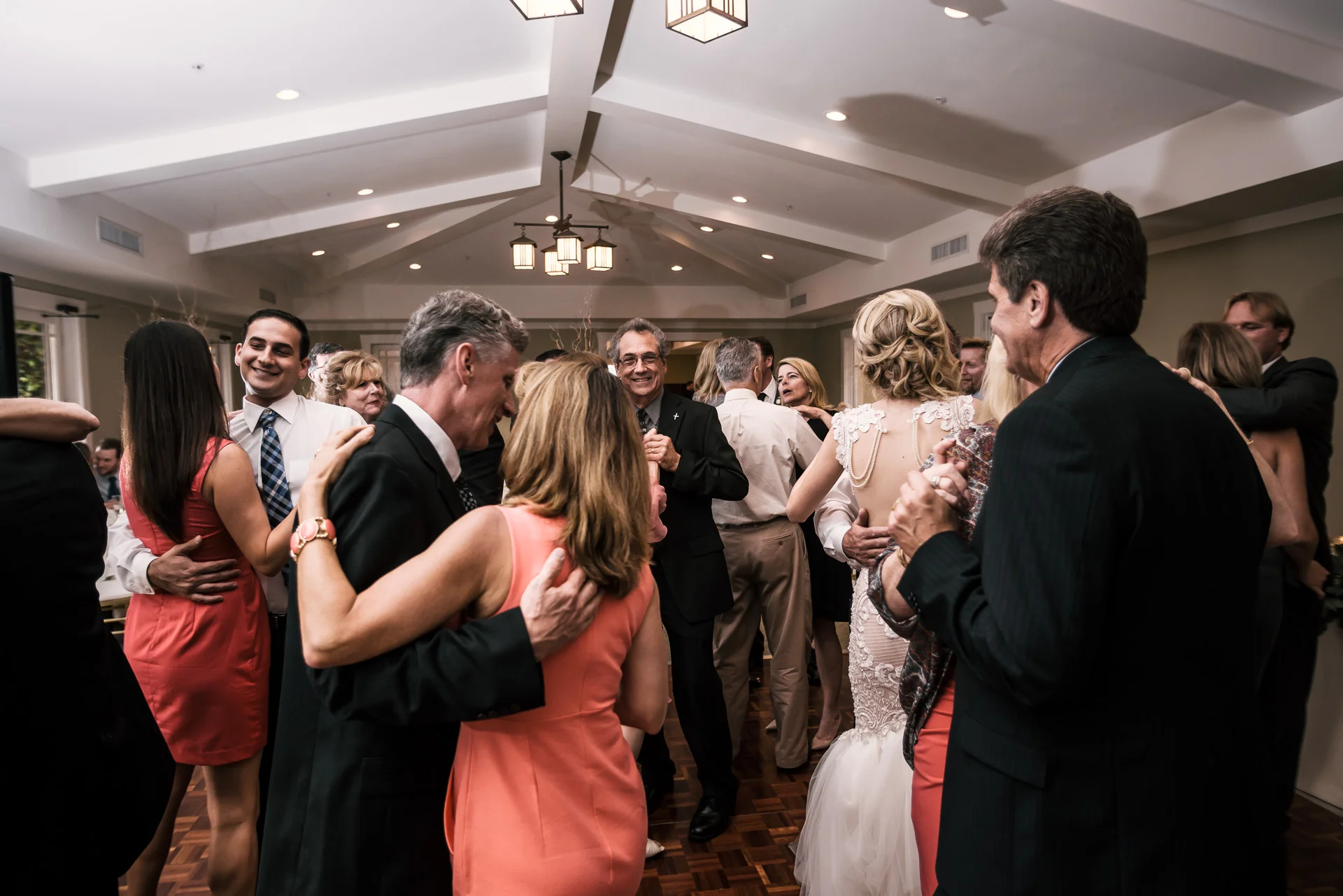 guests join the bride and groom on the dance floor at the Twin Oaks Golf Course in San Marcos, San Diegos premier wedding venue