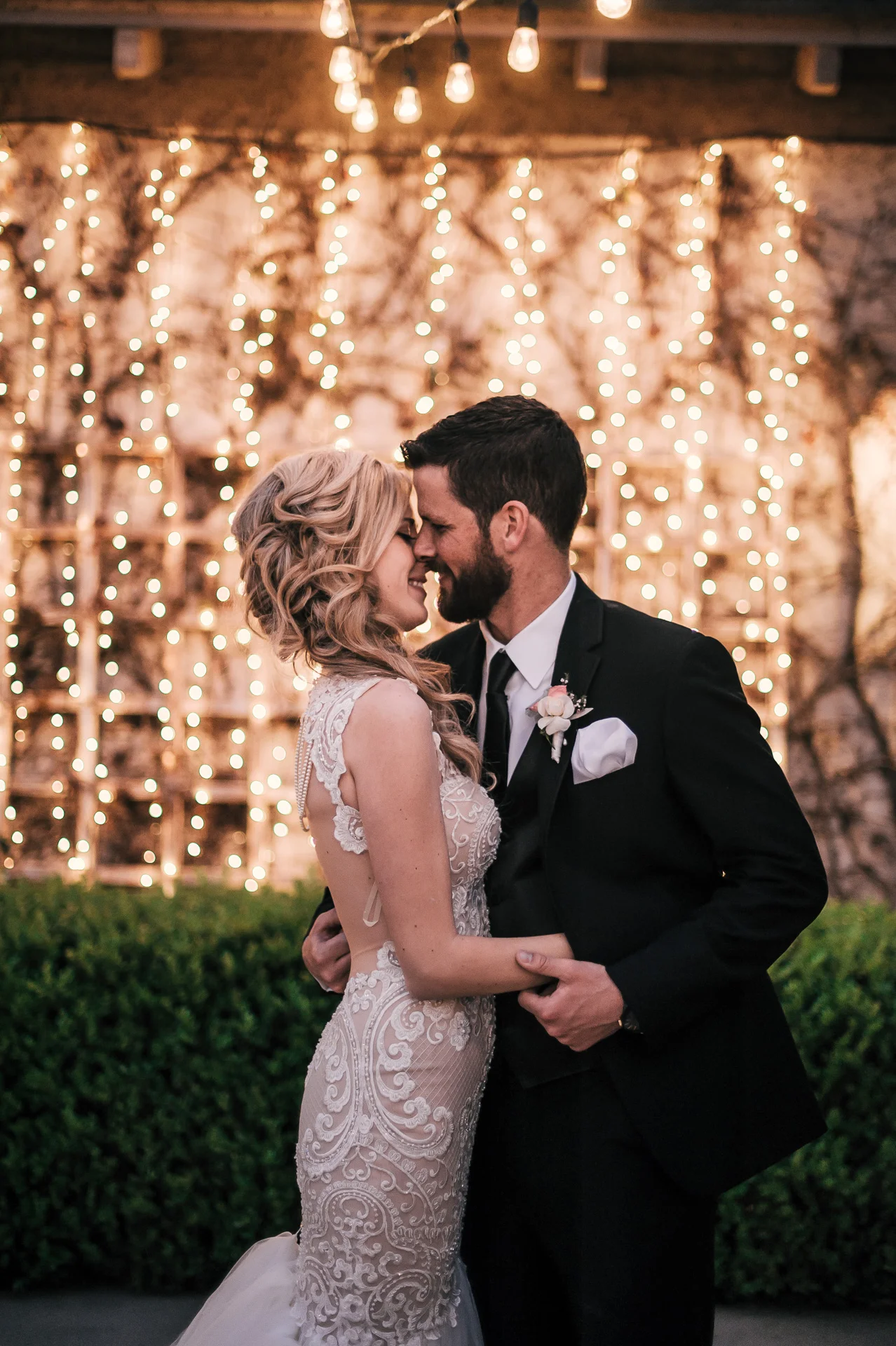 groom goes in for a kiss at the Twin Oaks Golf Course in San Marcos, San Diegos premier wedding venue