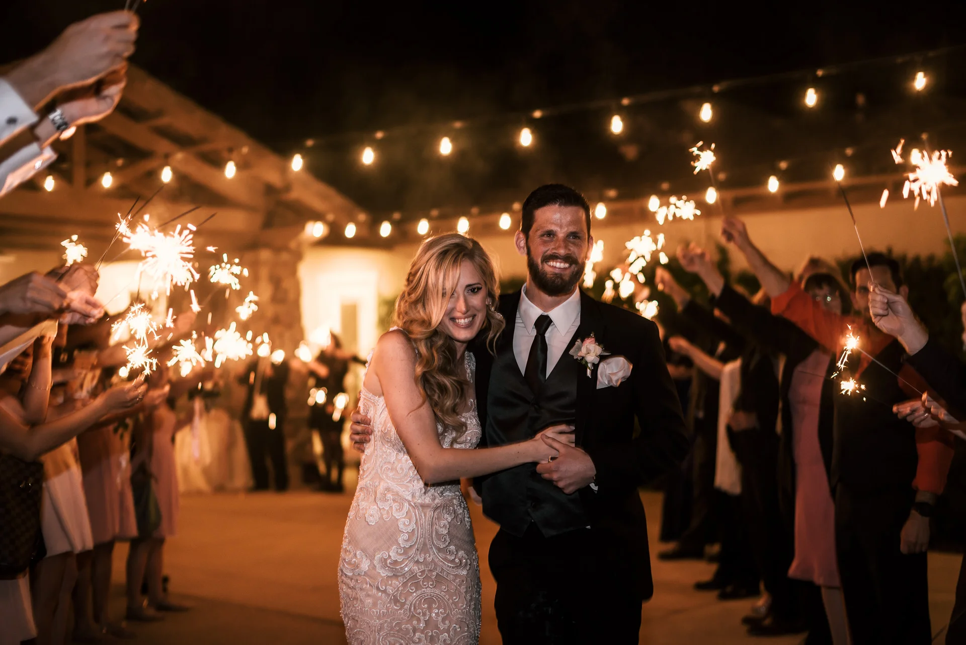 bride and groom make their grand exit at the Twin Oaks Golf Course in San Marcos, San Diegos premier wedding venue