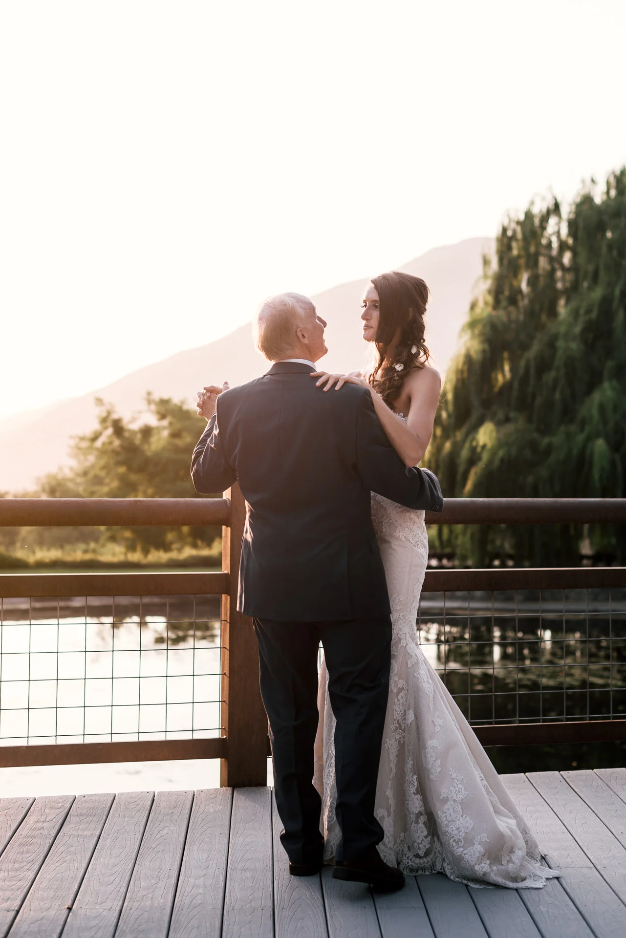bride dances with her father at the secret garden located at the Historic Parish ranch in Oak Glen California