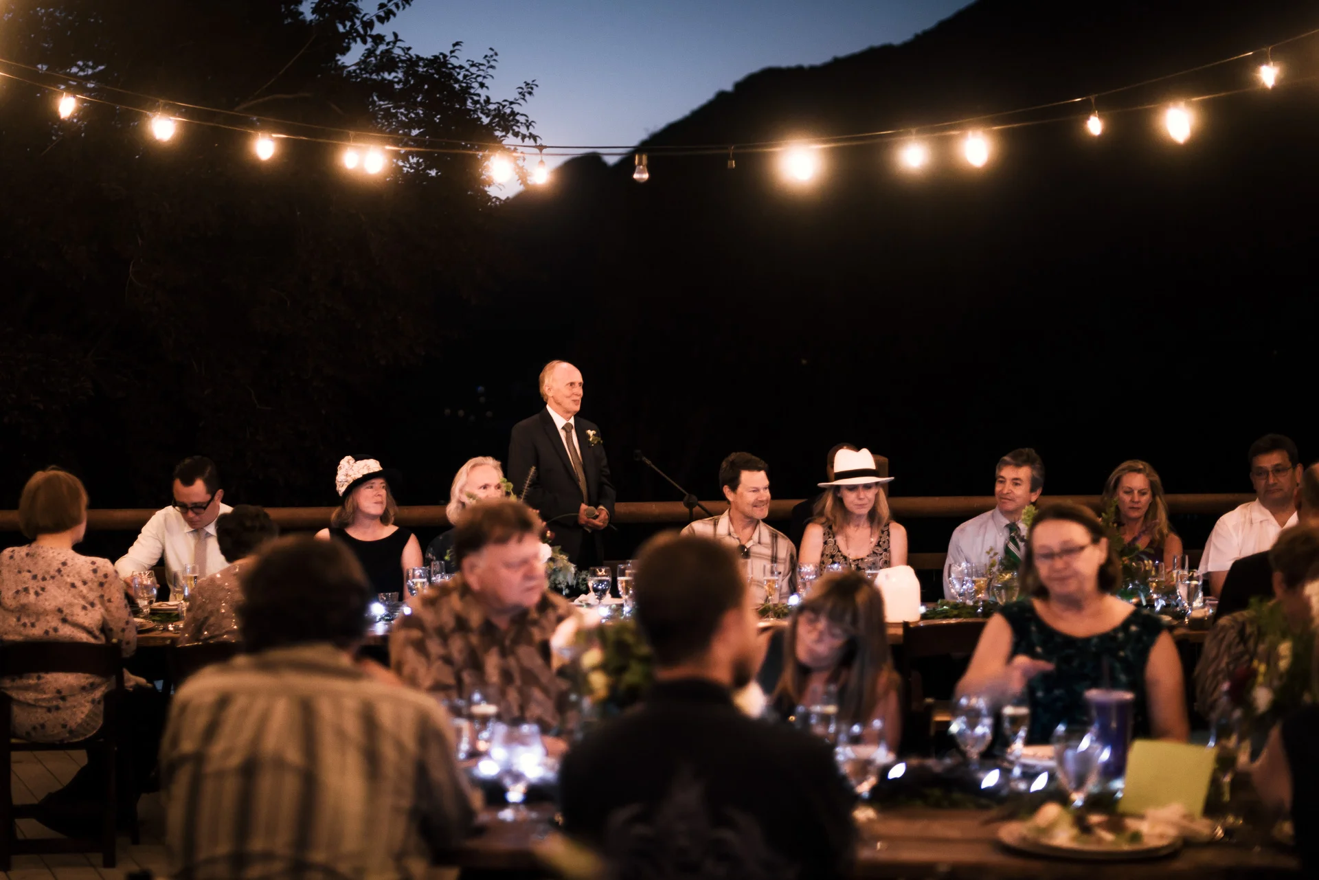 father of the bride makes a toast at the secret garden located at the Historic Parish ranch in Oak Glen California