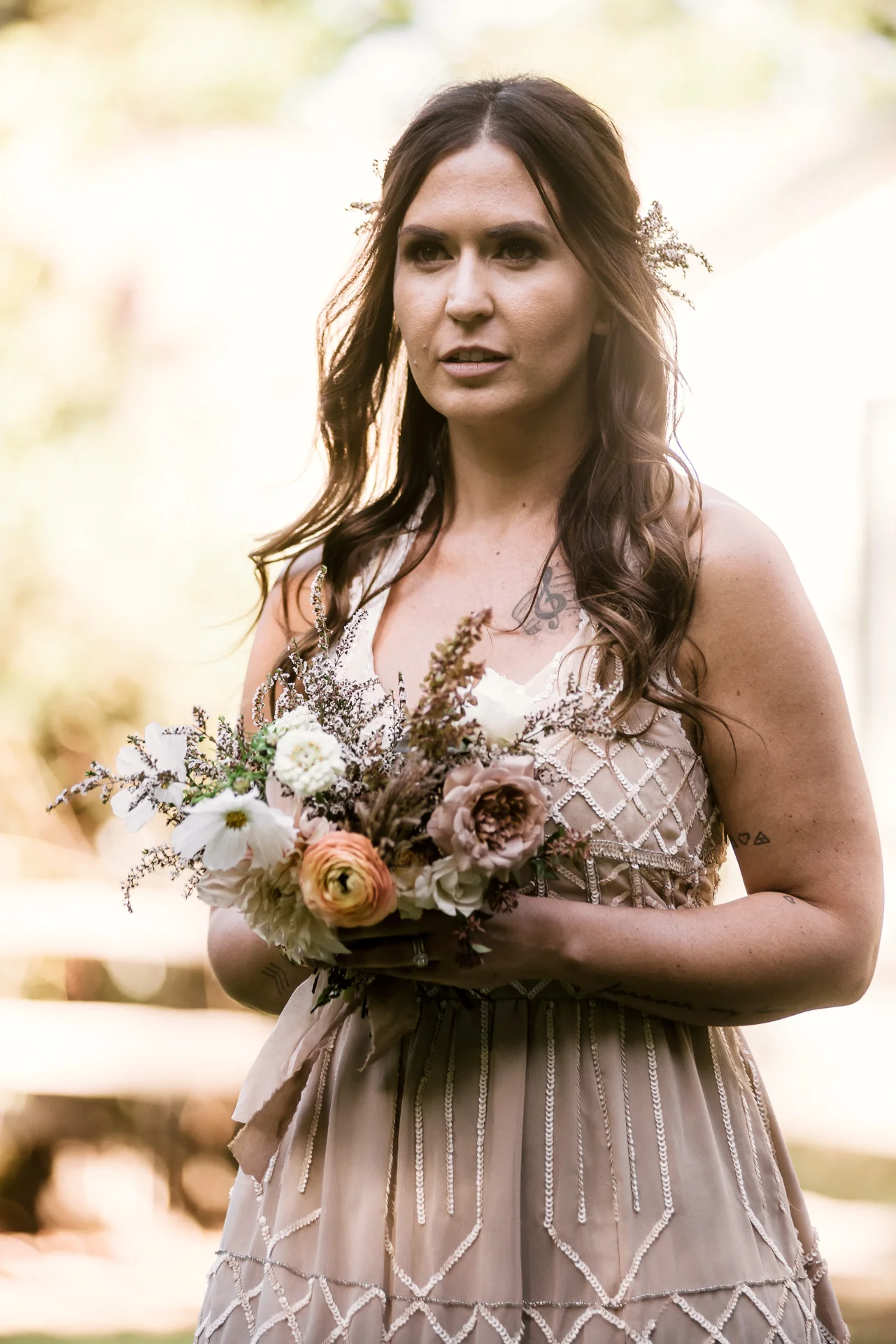 bridesmaid and her bouquet shot by wedding photographer at the charming St. George Hotel in Volcano California
