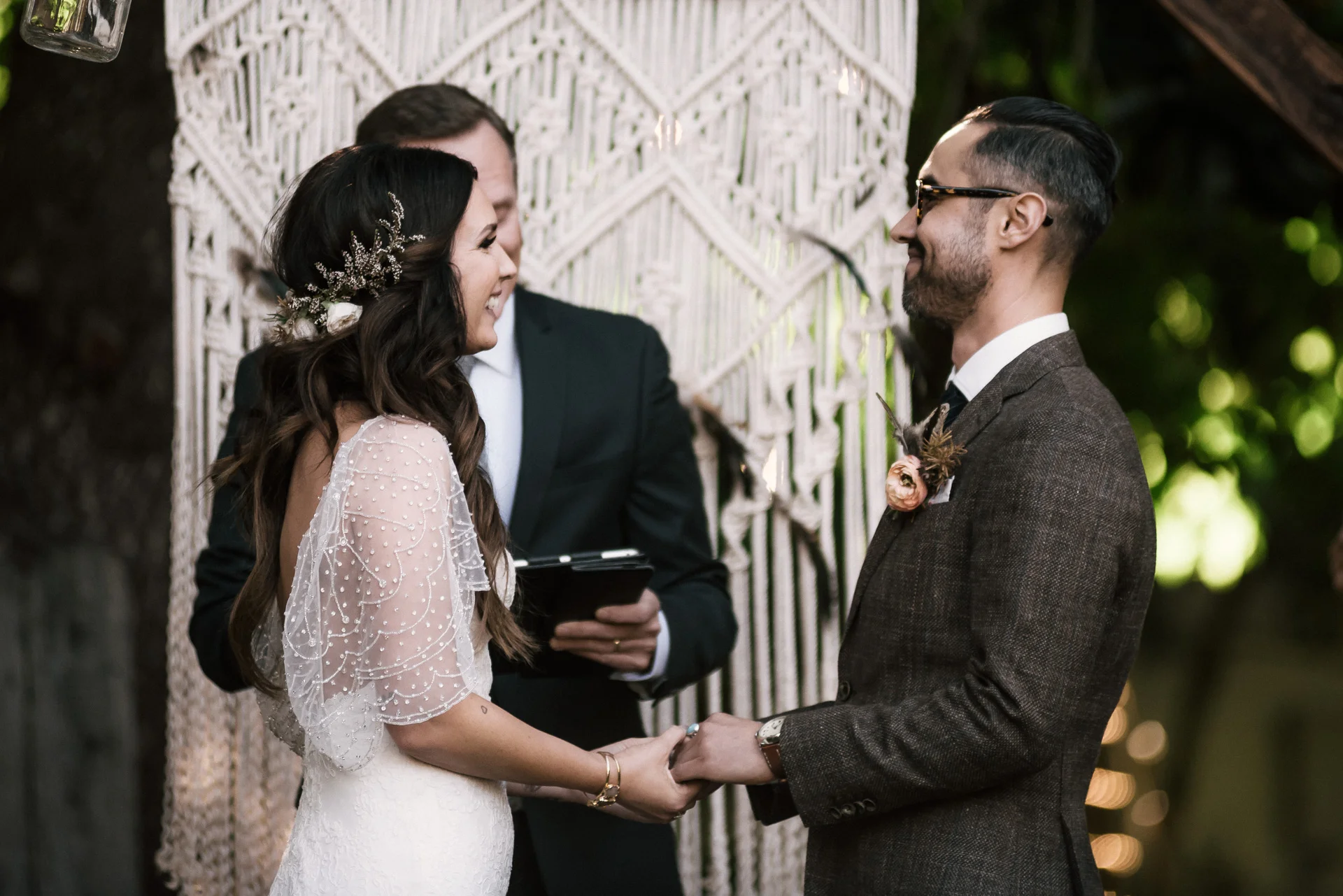 bride smiles at her groom shot by wedding photographer at the charming St. George Hotel in Volcano California
