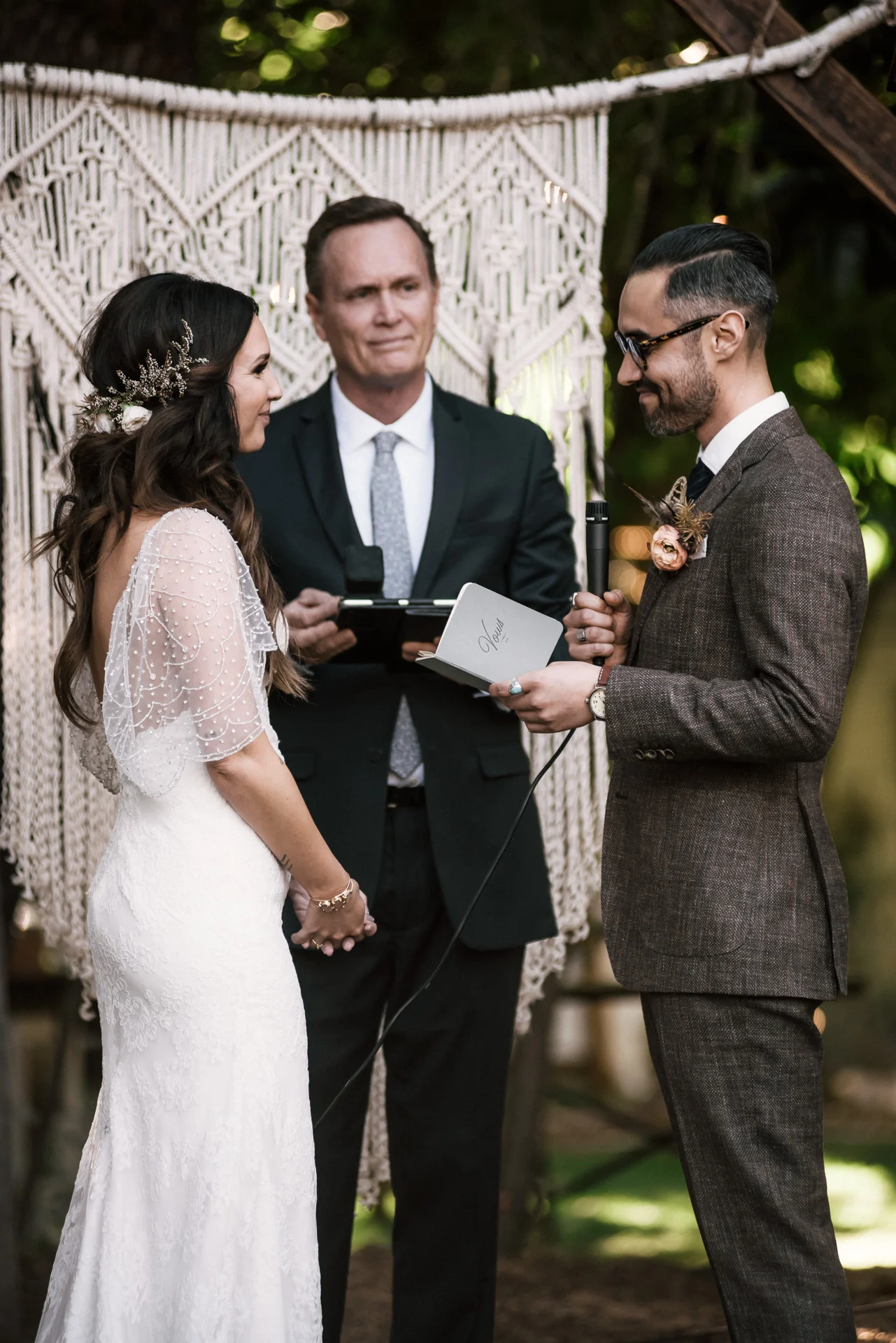 bride listens intently to her grooms vows shot by wedding photographer at the charming St. George Hotel in Volcano California