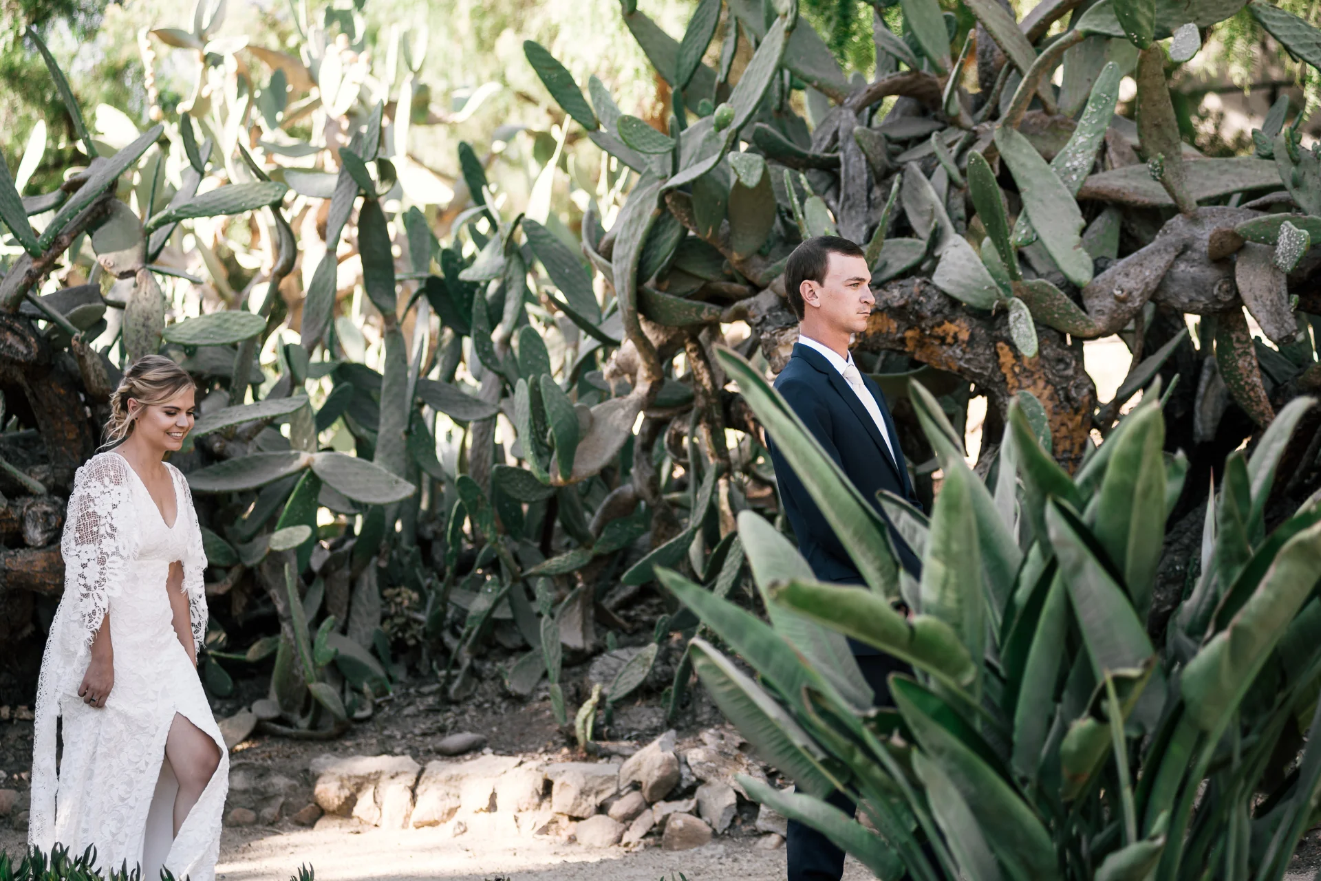 bride apporaches groom for first look captured by photographer during romantic wedding at the historic Leo Carrillo Ranch in Carlsbad California