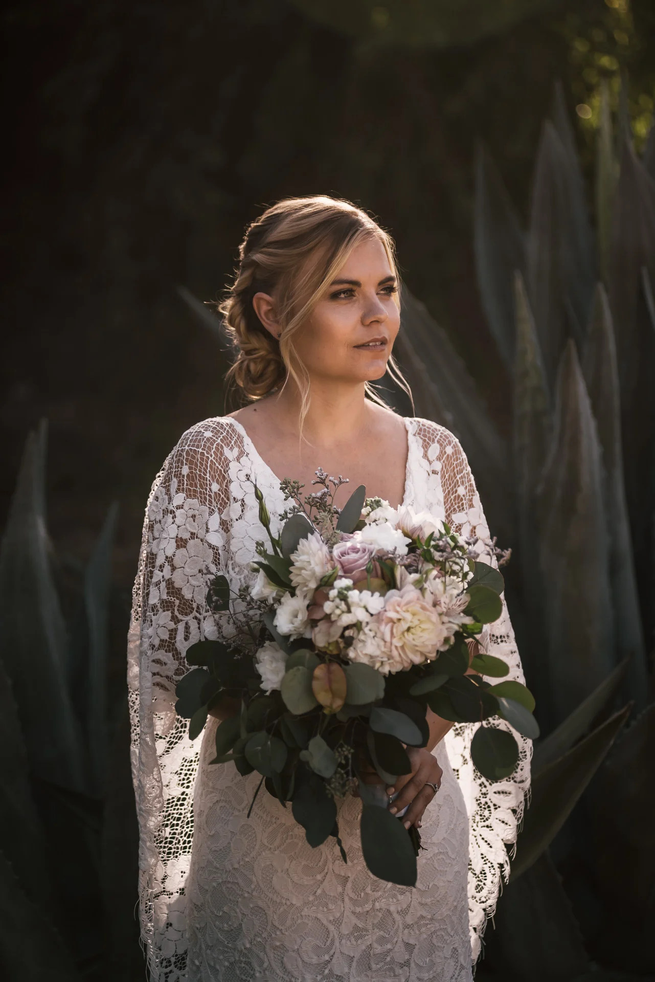 Beautiful bridal portait in front of agave plants captured by photographer during romantic wedding at the historic Leo Carrillo Ranch in Carlsbad California