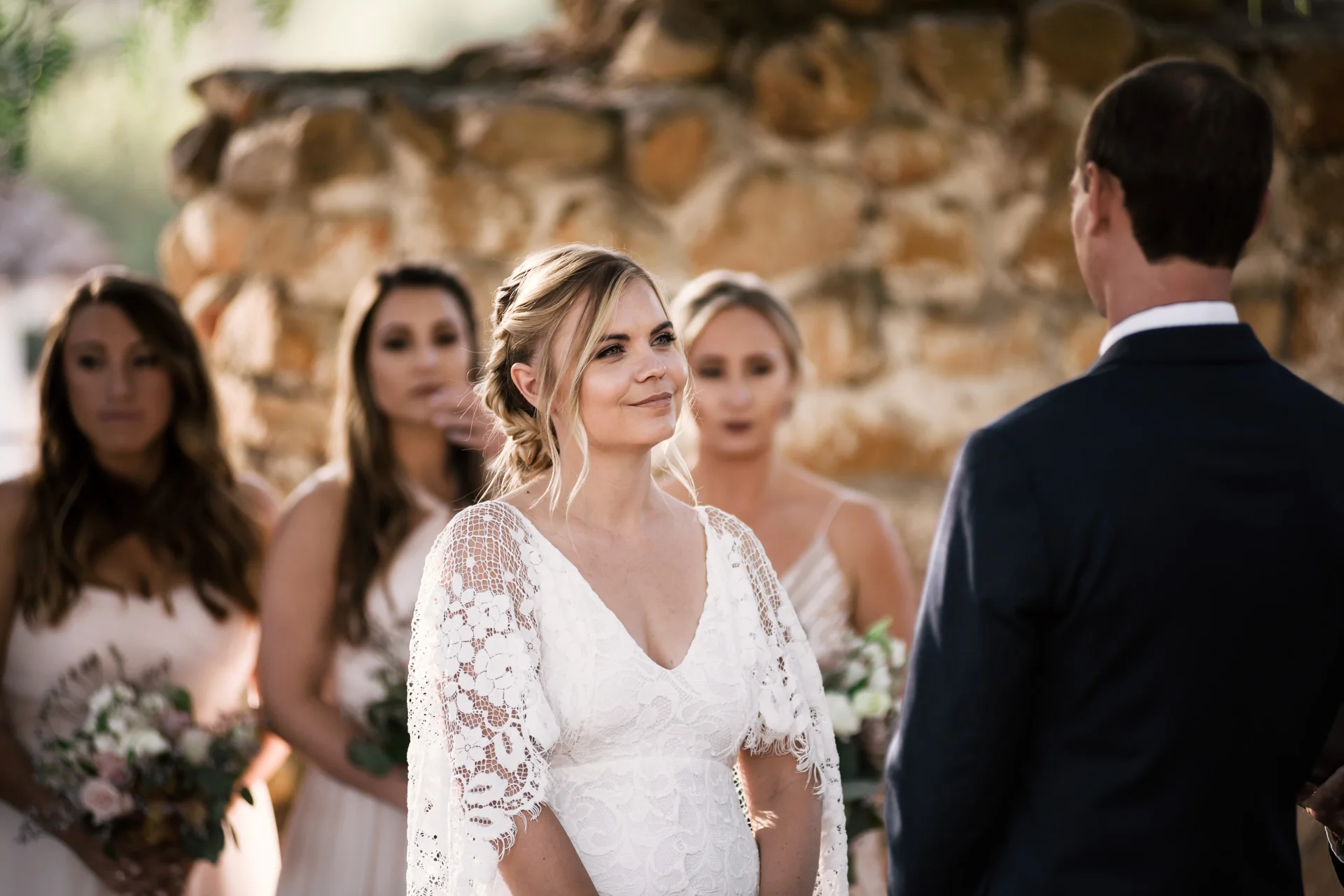 bride looks lovingly at her groom captured by photographer during romantic wedding at the historic Leo Carrillo Ranch in Carlsbad California