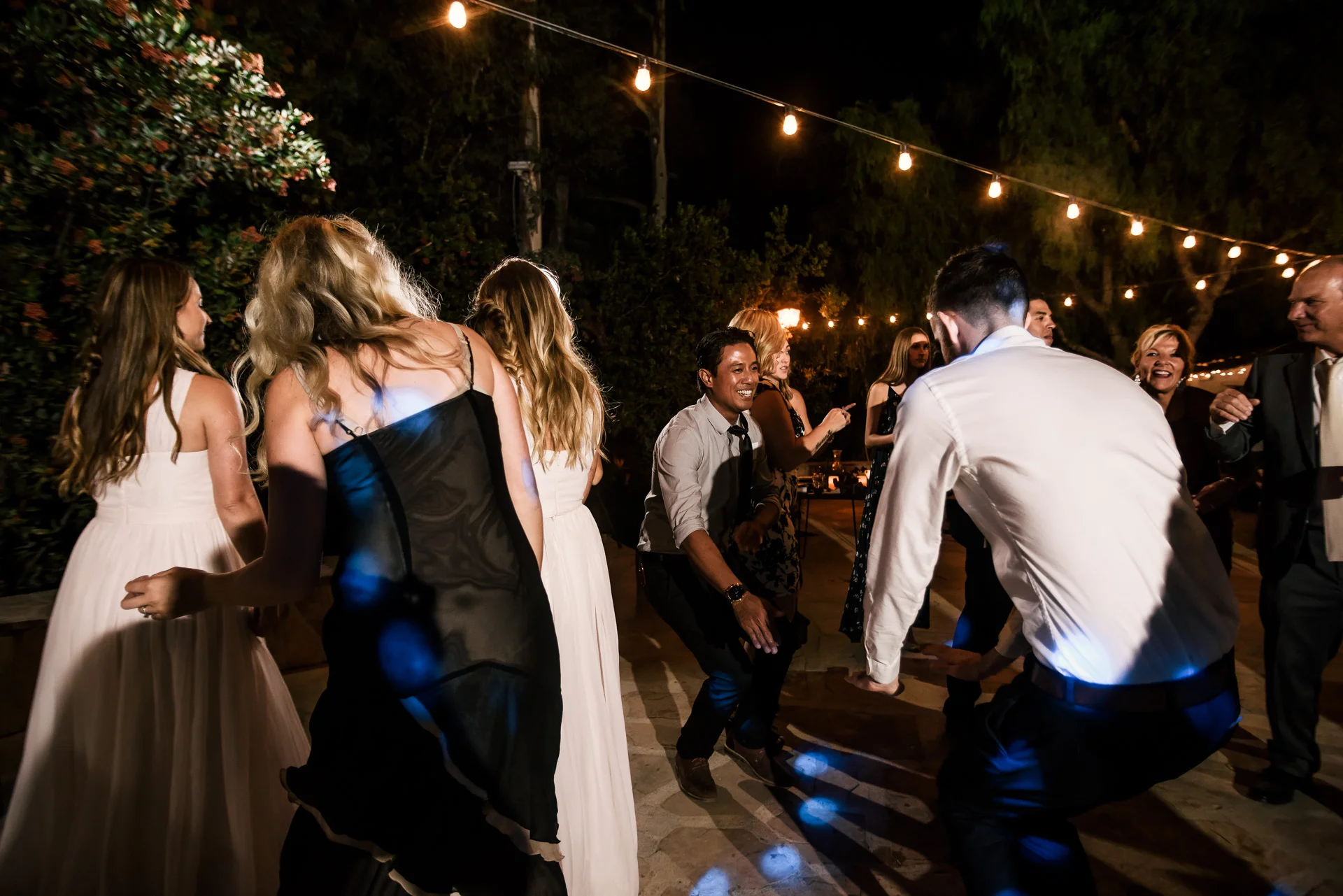 guests tear it up on the dance floor captured by photographer during romantic wedding at the historic Leo Carrillo Ranch in Carlsbad California