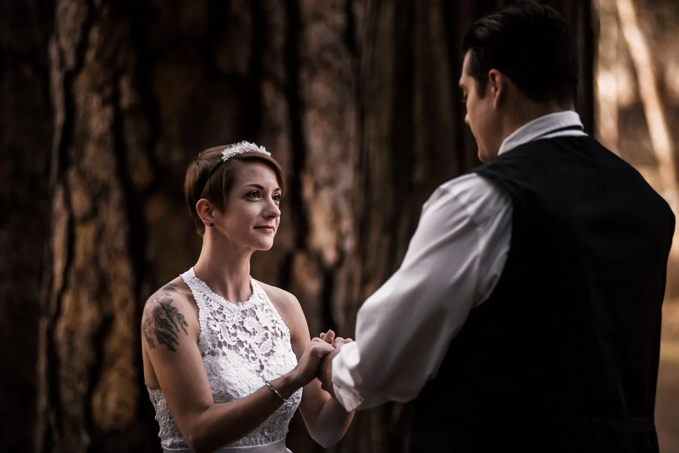 bride looks lovingly at her groom