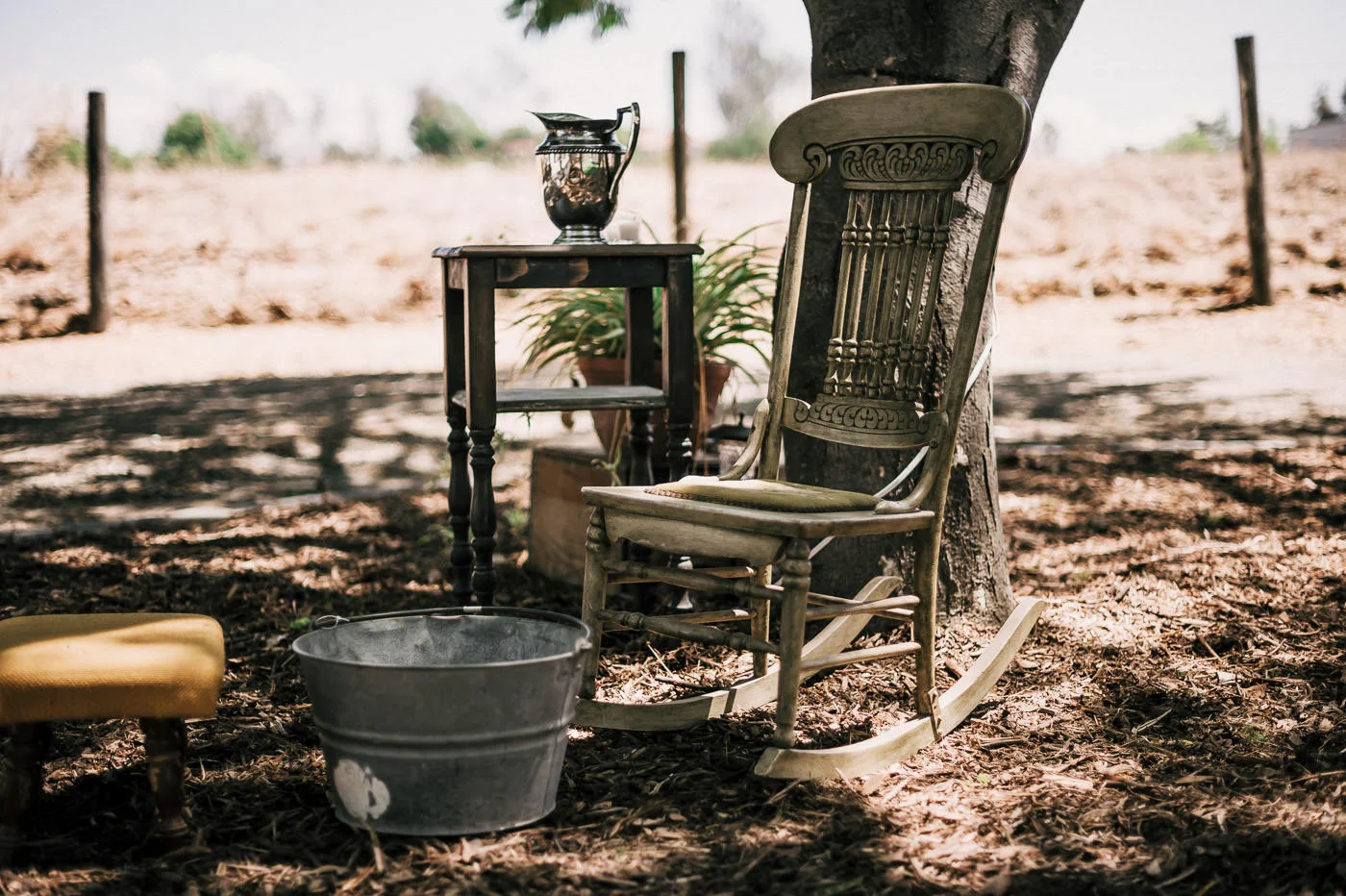 Vintage Rocking chair and metal basin for christian foot washing ceremony at Temecula wine country wedding