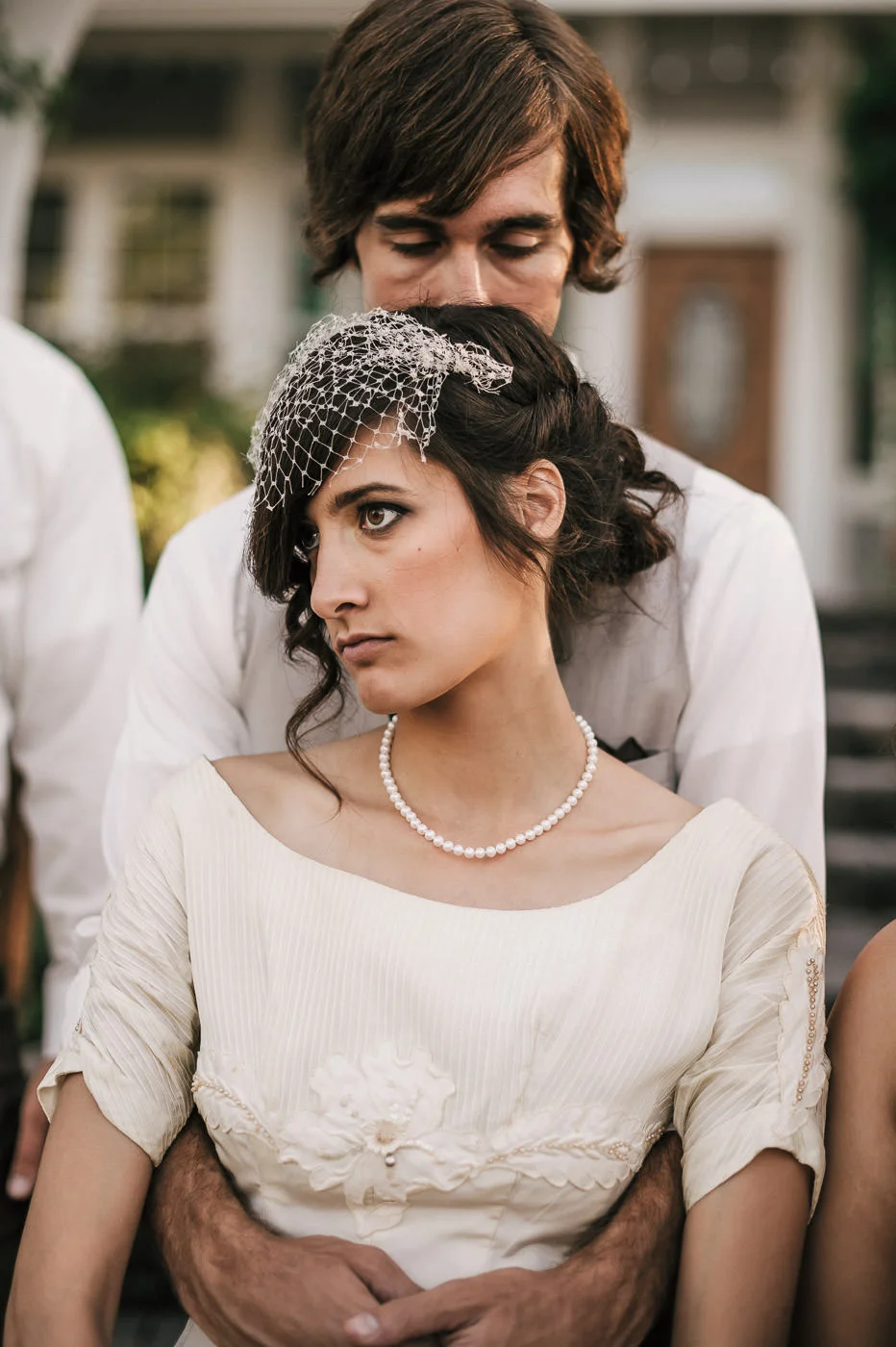 Groom sweetly comforts his bride after a long day at their Temecula wine country wedding