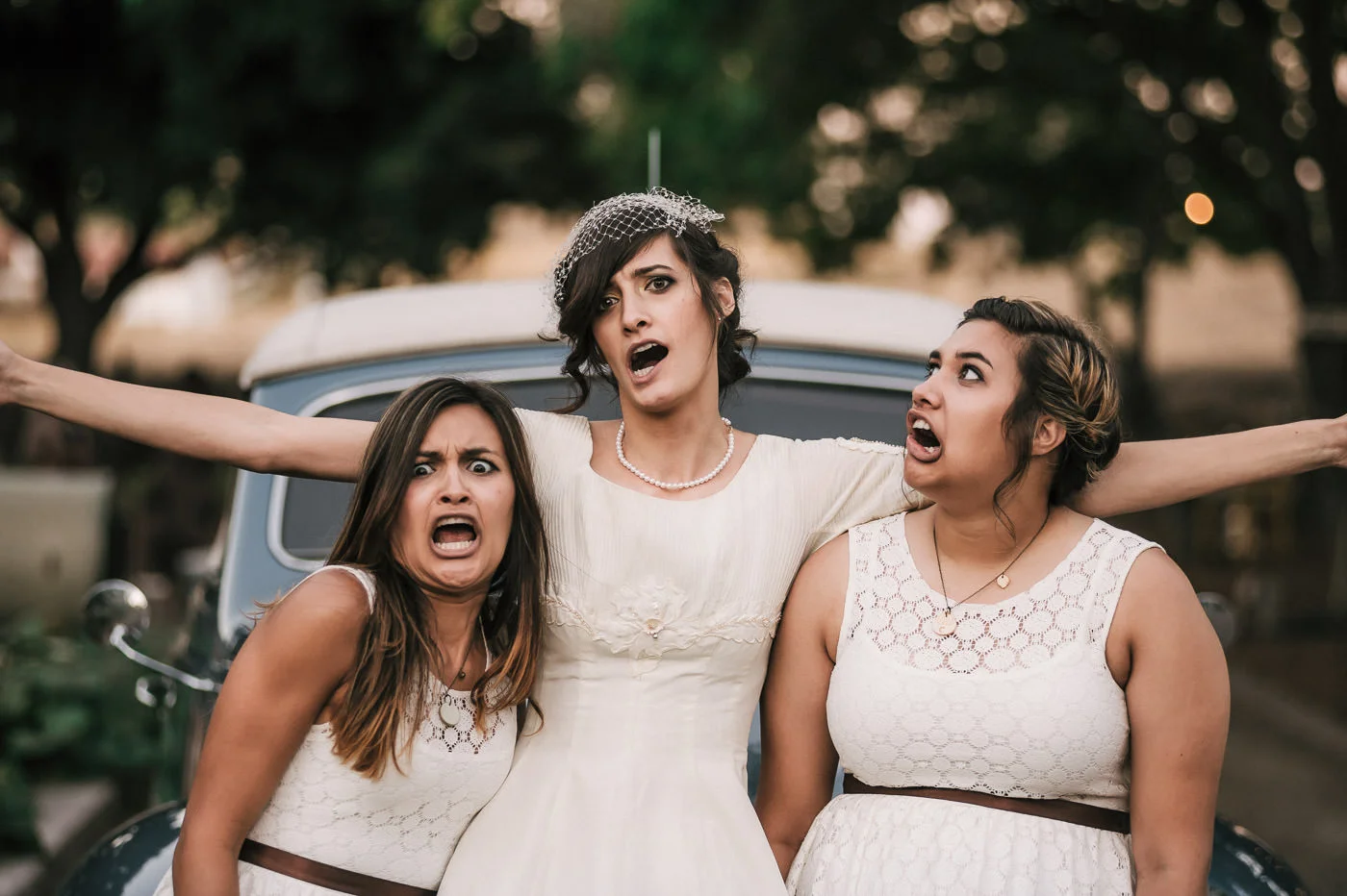 Bride gets goofy with her bridesmaids at her temecula wedding