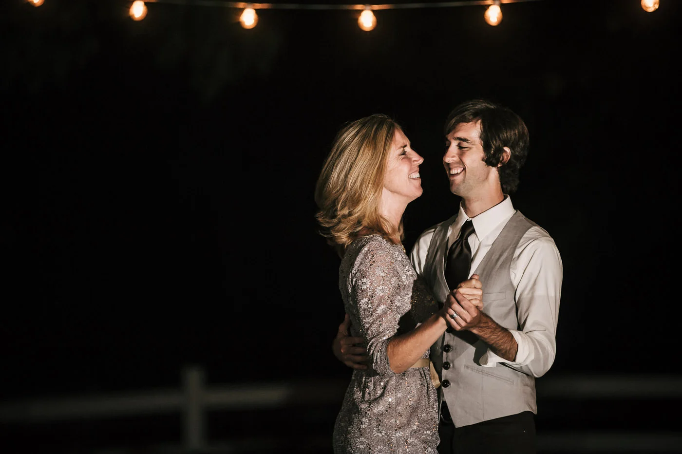 Mother and son have a joyful turn on the dance floor