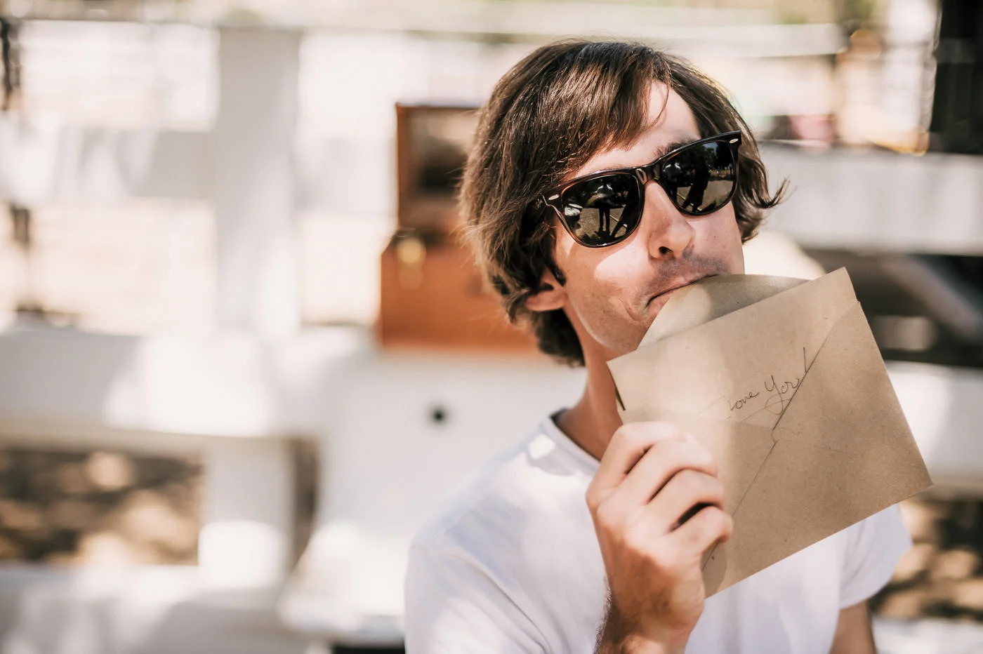 Groom opensa love letter from the bride before their romantic Temecula Wine coutnry wedding
