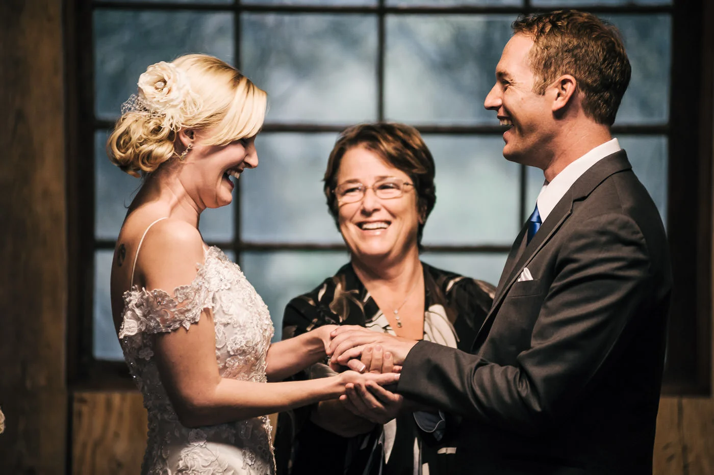 best wedding photograper in temecula california captures a couples sweet laugh during their ceremony at whispering oaks terrace