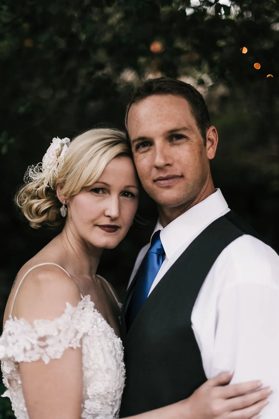 couple gets close and takes a seriously romantic portrait at their country wedding