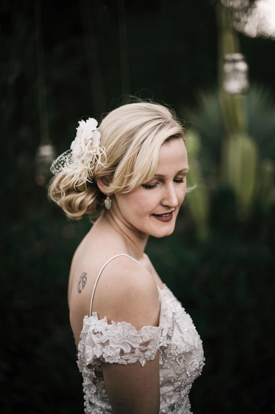 gorgeous vintage styled bride poses for portraits before her wedding at the whispering oaks terrace venue.