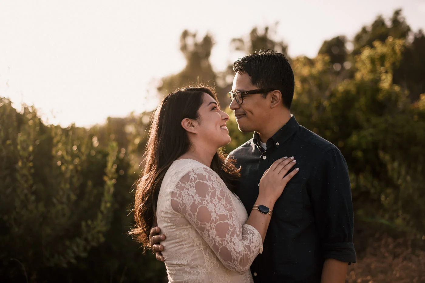 Staring deep into each others eyes at sunset this couple puts their love on display at their engagement at El Matador state beach.