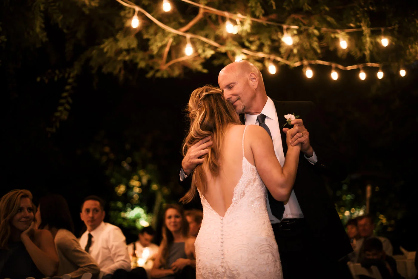 Father is overcome with emotion as he dances with his daughter at the recpetion after a romantic Temecula Wedding.