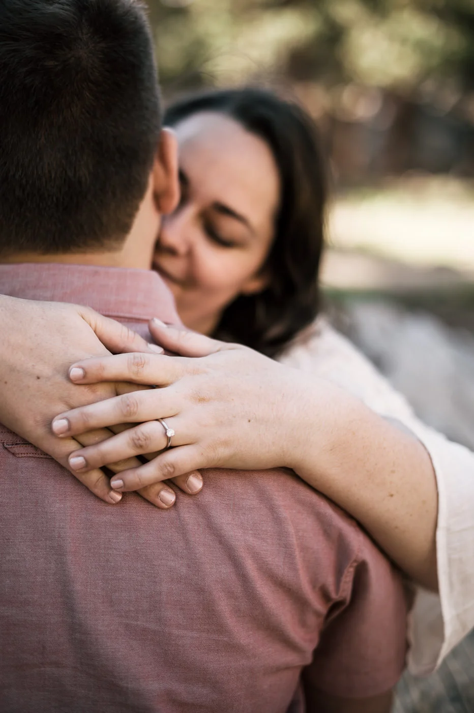 beautiful diamon engagement ring on display in this portrait.