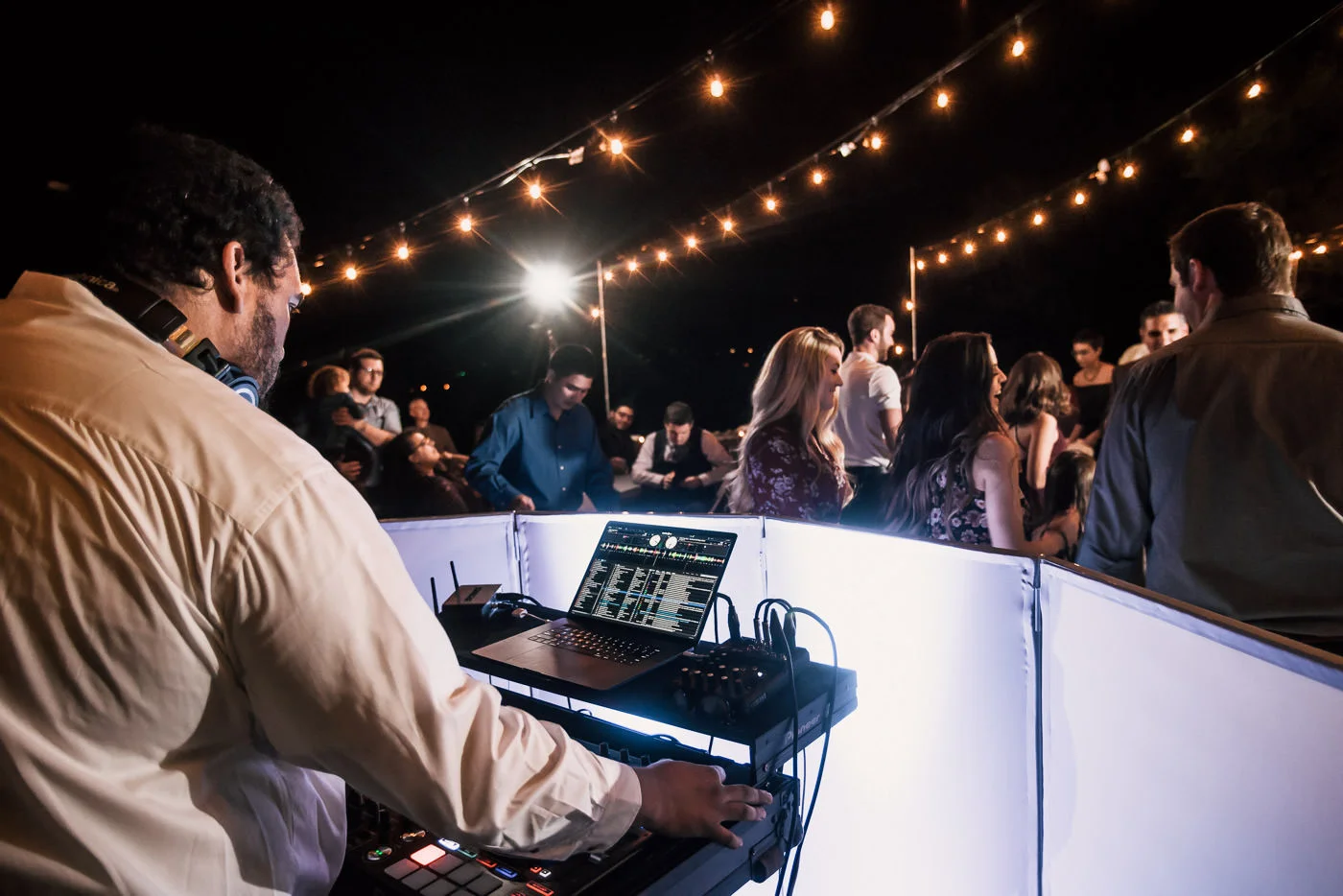 Guests tear up the dance floor as the Dj plays at this Temecula wedding reception.