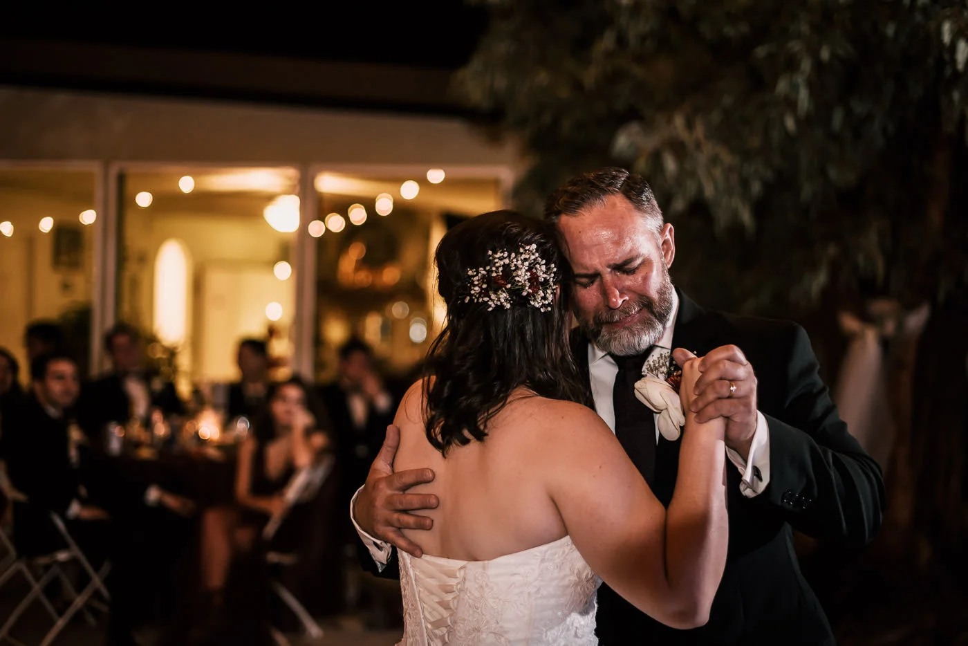 Touching photograph of a father dancing with his daughter at her Temecula wedding.
