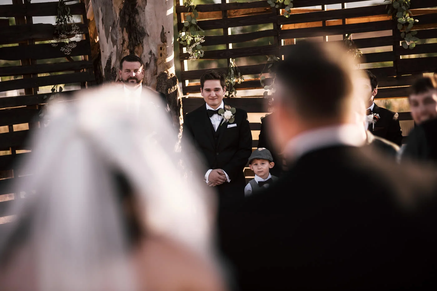Emotional groom sees his bride for the first time as she walks down the aisle.