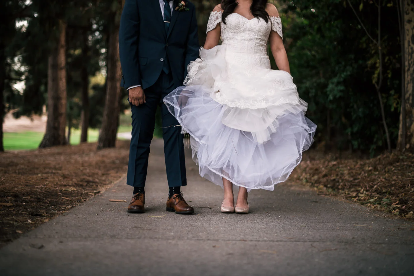 Great wedding photo Idea; bride and groom show off their shoes.