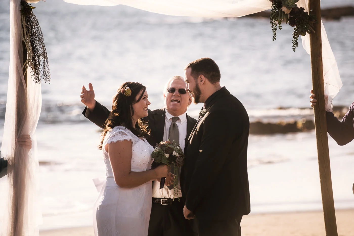Ministor begins the ceremony as these two lovebirds are overcome with joy.