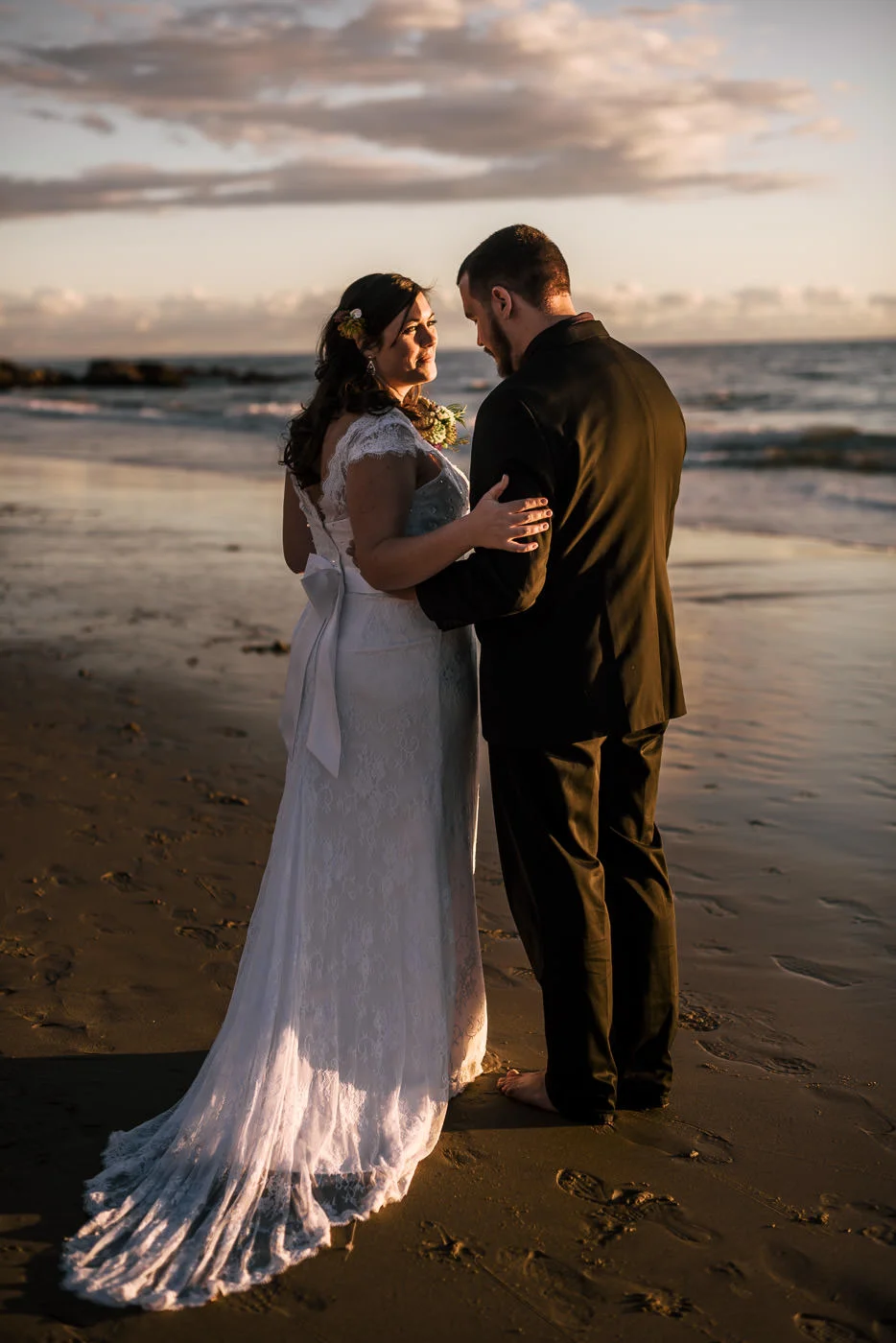 Dramatic photo of a newly married bride and groom at Laguna Beach.