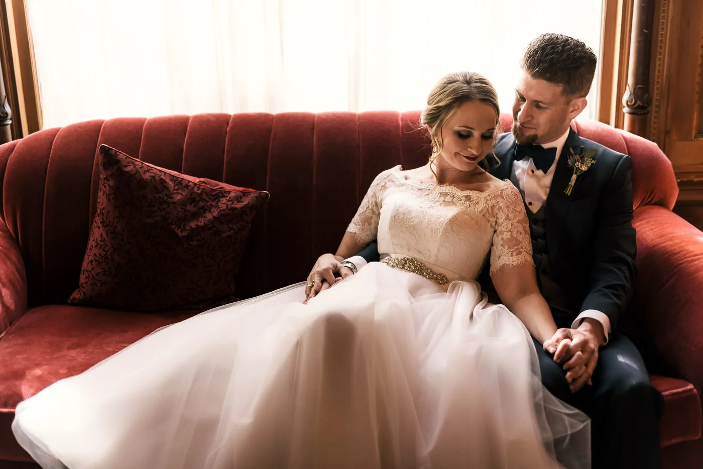 Lovebirds with vintage style have a tender moment alone before their wedding.
