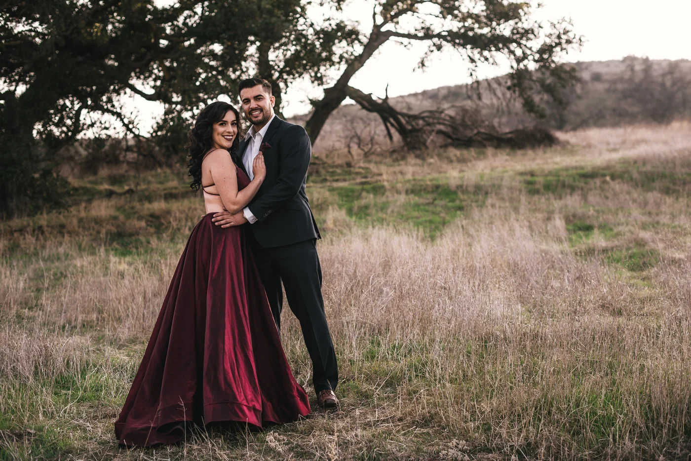 Engaged couple poses for their California wedding photographer.