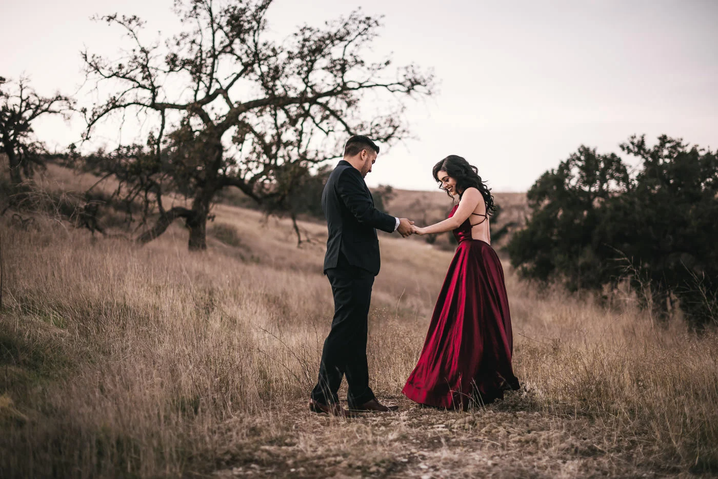 Future bride picks absolutely stunning red dress for her engagement session.