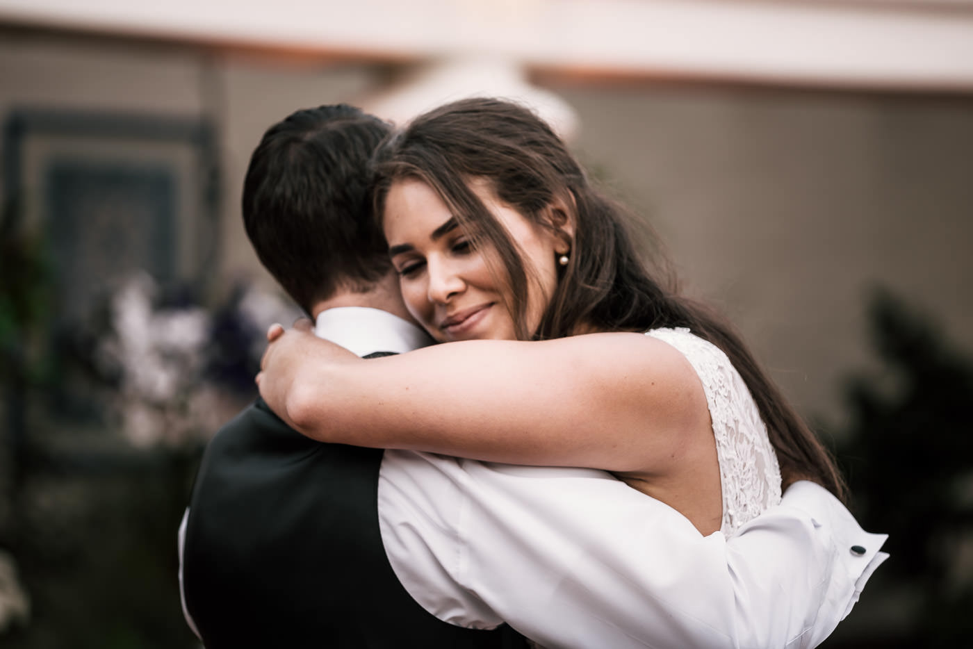Sweet moment between two lovebirds as they enjoy their first dance at the Darlington House in La Jolla California