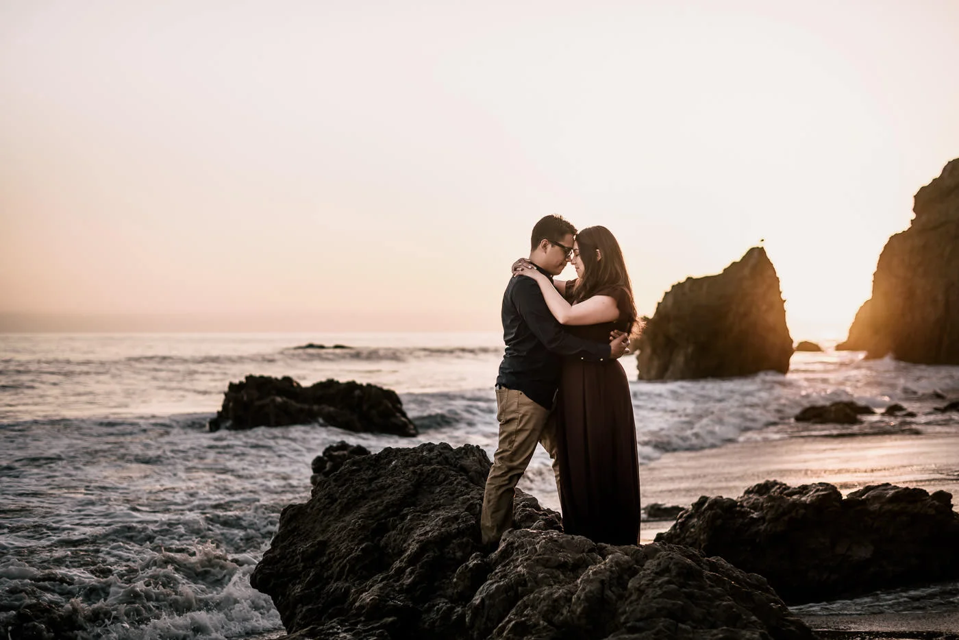 There's nothing more romantic than wedding photos on the sea rocks as the waves crash around.