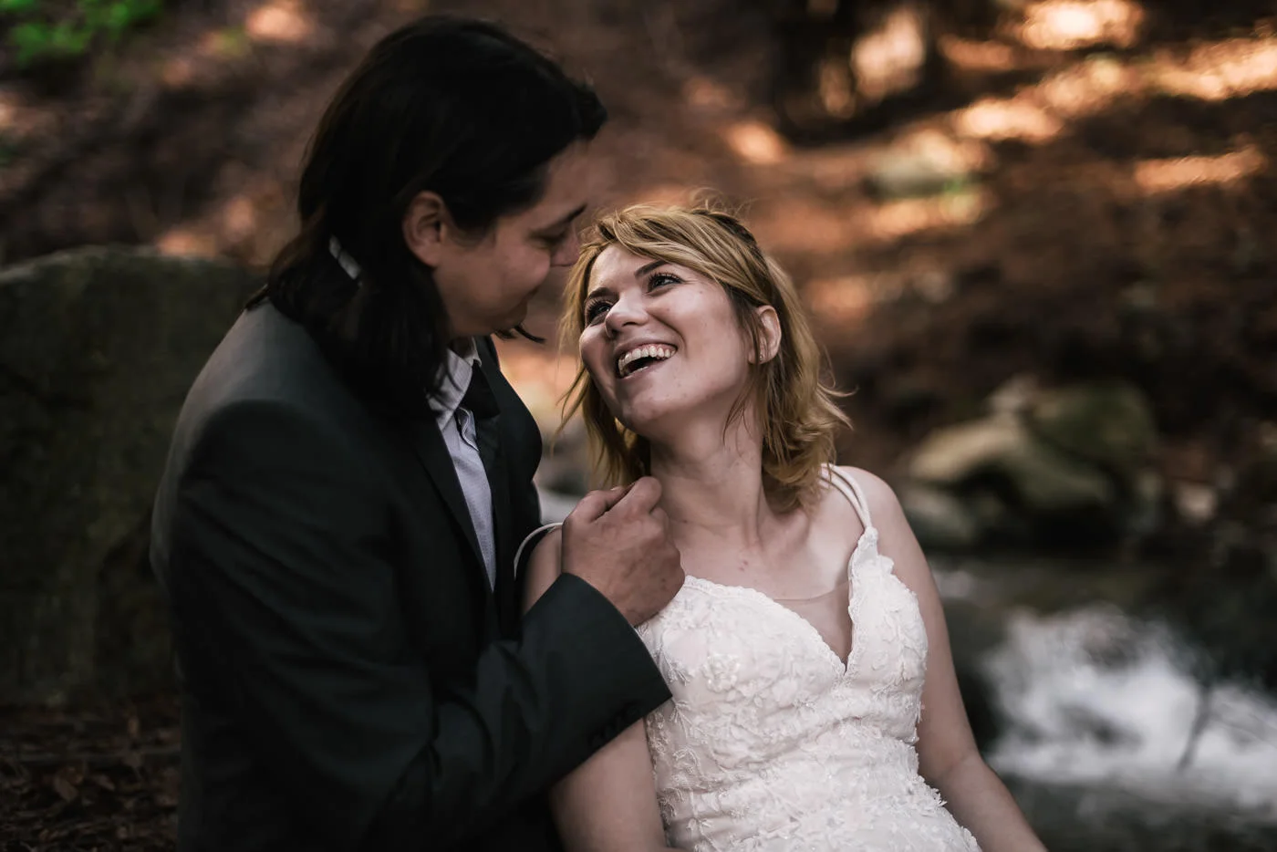 Bride gives her husband a big smile at their elopement.