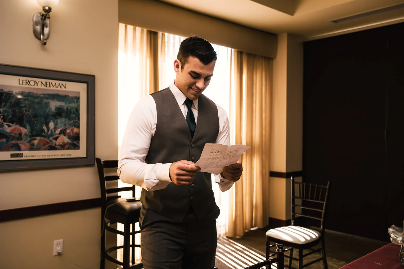 Groom reads a letter from his future wife before their ceremony.