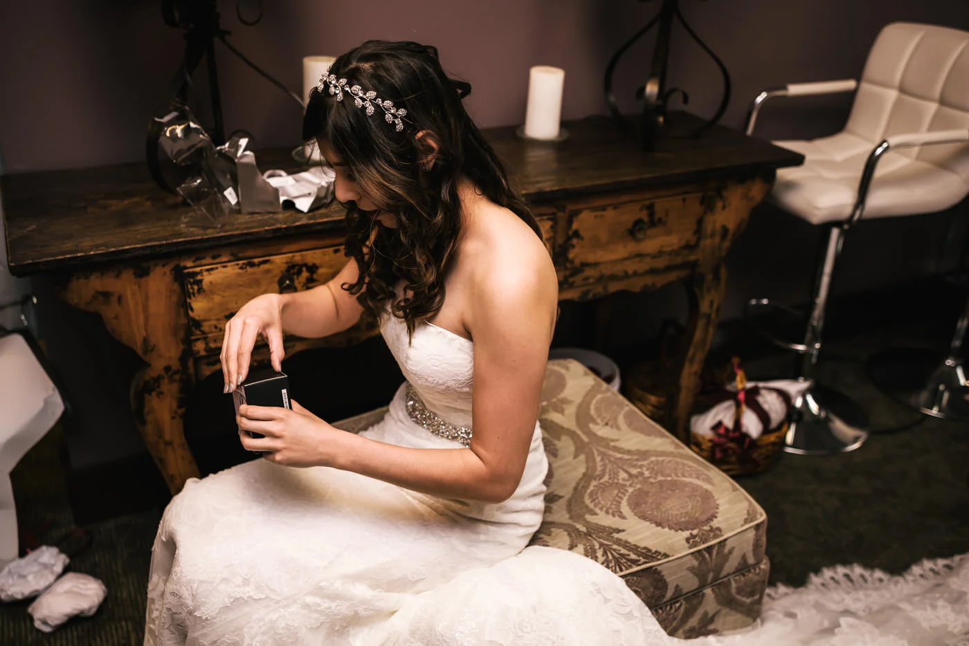 Bride opens a gift from her soon to be husband.