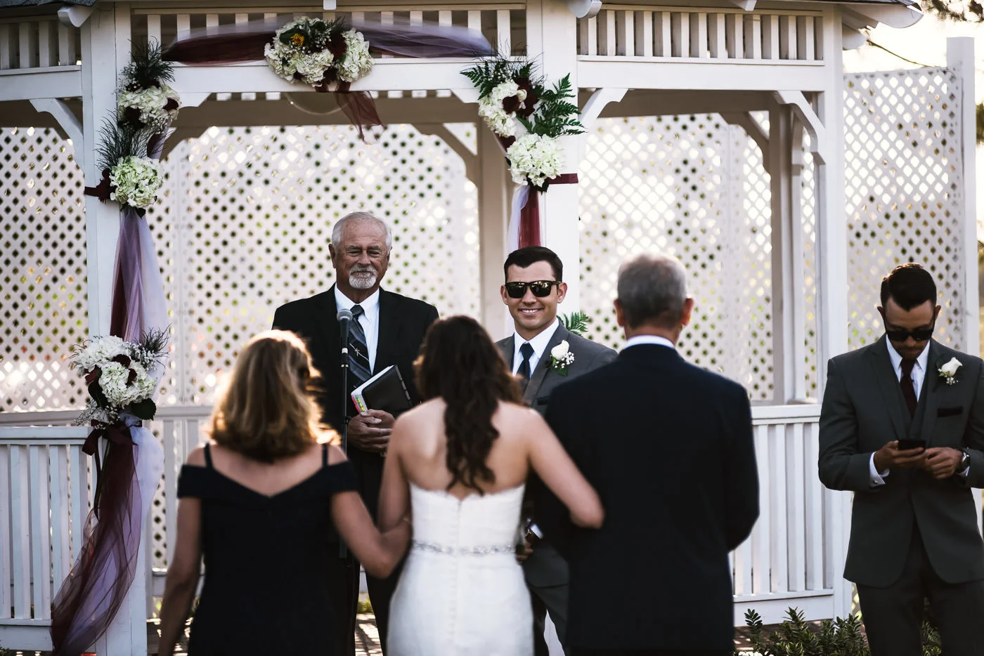 Happy groom is all smiles as he stares at his beautiful bride.