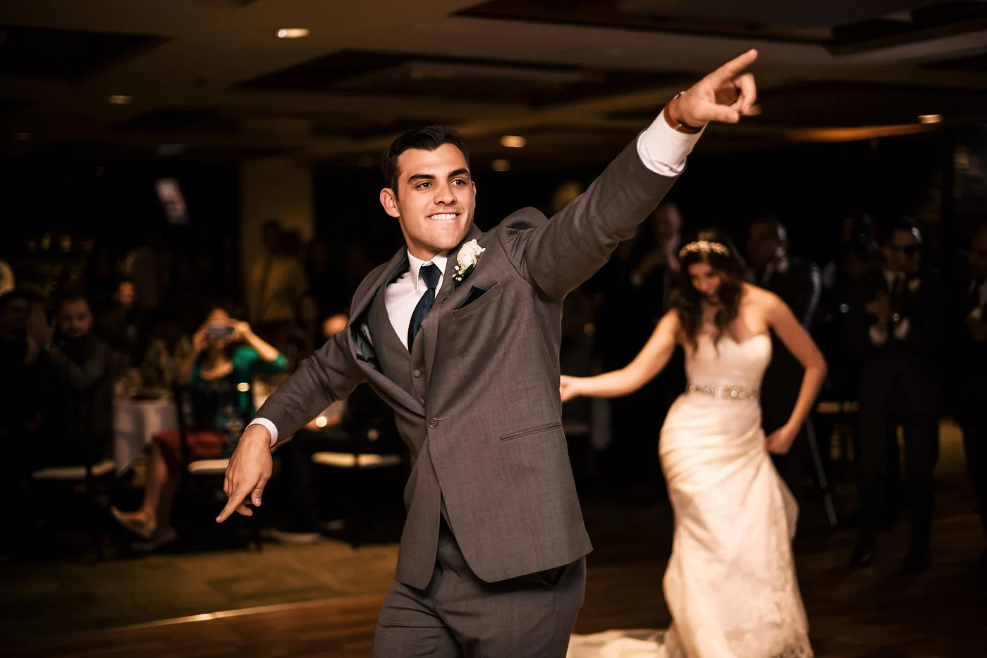 Newlyweds hit the dance floor at their reception for their first dance.