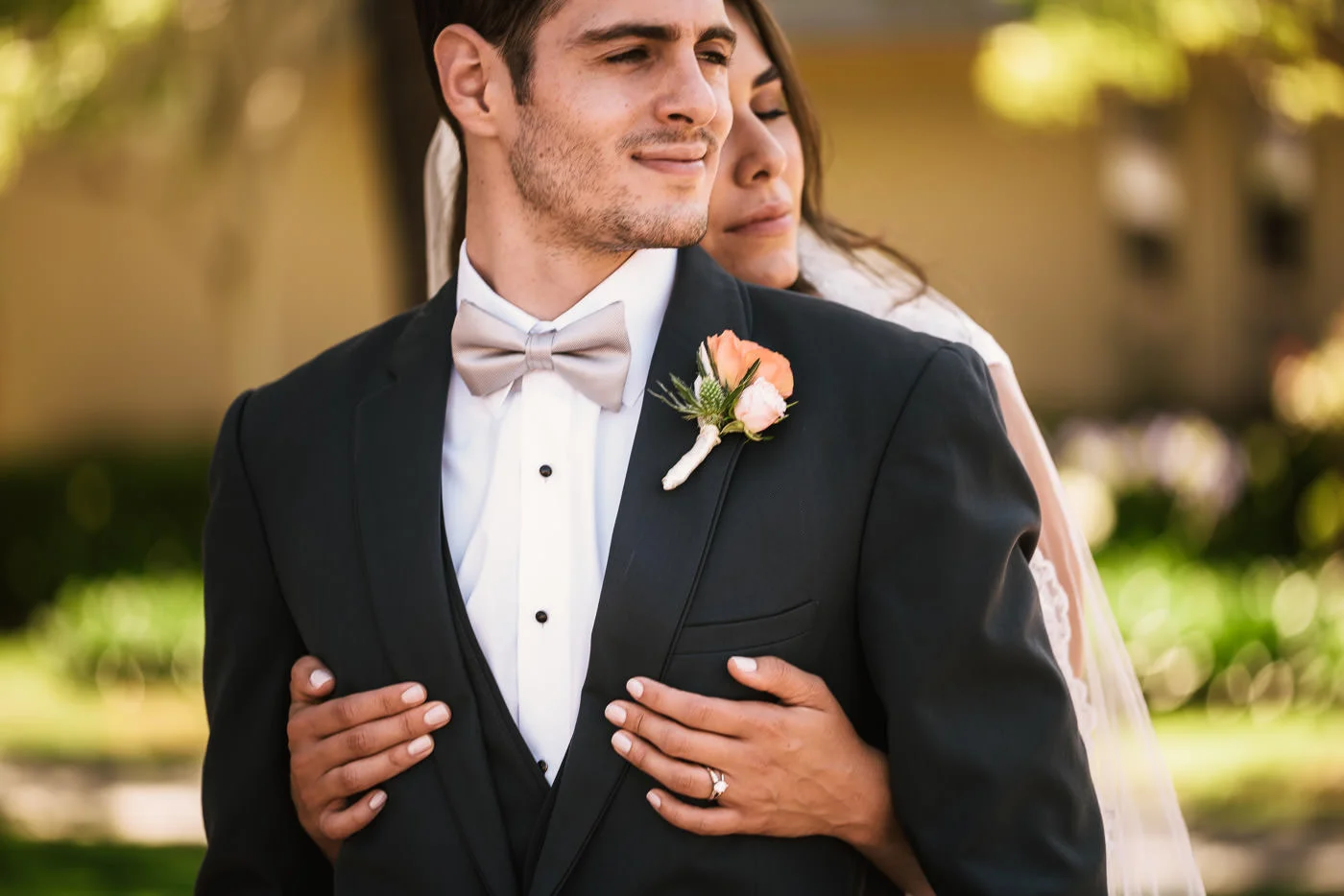 Brides holds her new husband tightly.