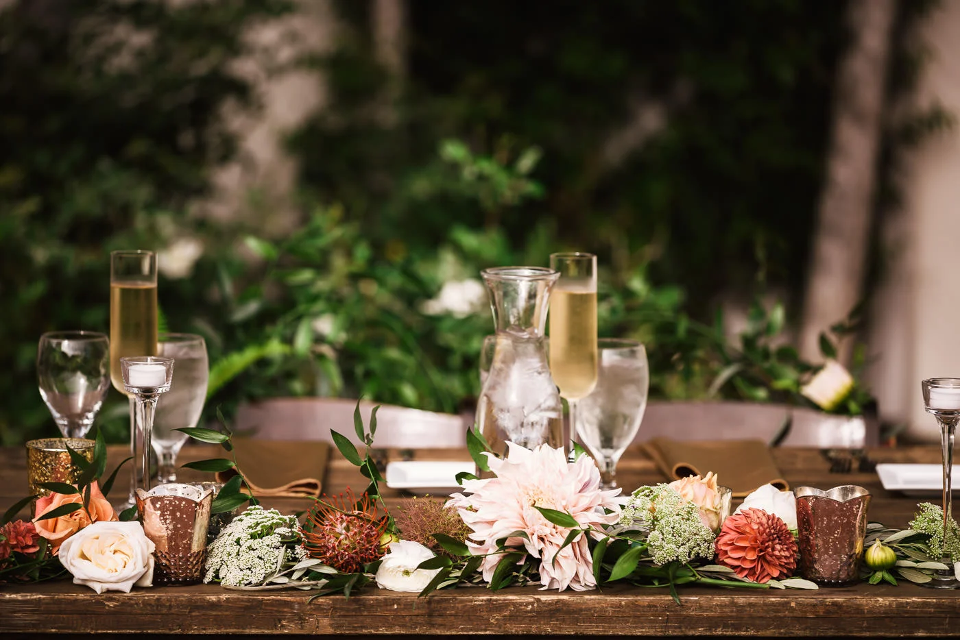 Sweetheart table decorations and floral arrangements.