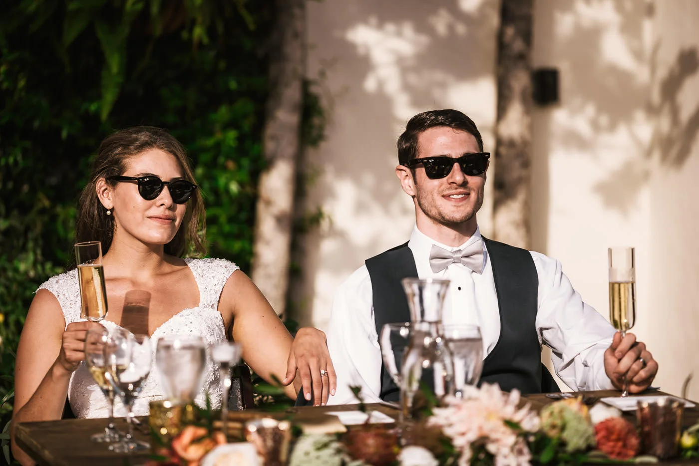 Couple rocks their shades for a cool picture at their reception.