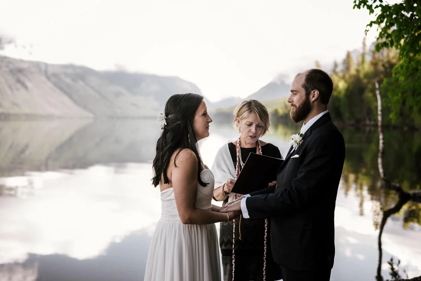 Couple holds hands as they say pledge their lives to one another.