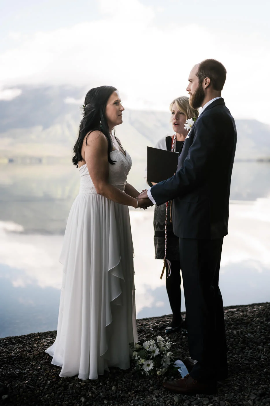 Adventurous elopement on the lake shore in Glacier National Park.