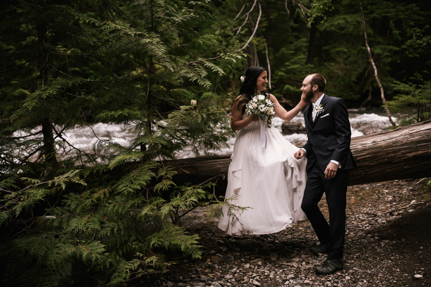 Couple hikes up to Avalanche Lake stopping for photos along the way.